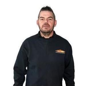 Male Employee smiling with white background