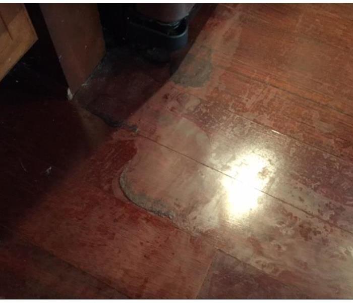 hardwood floors damaged due to ongoing leak