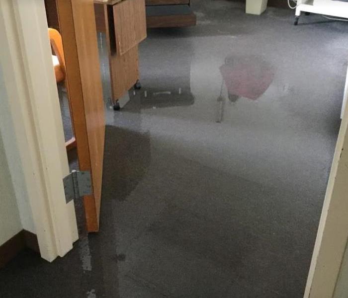water on floor of commercial building