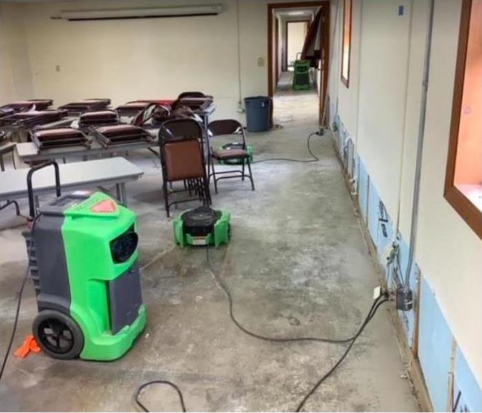 flooring removed, equipment set and flood cut in commercial building