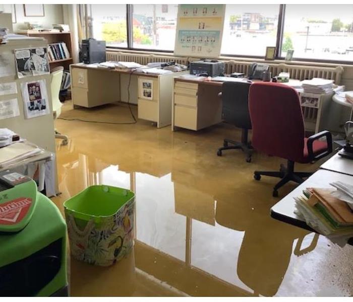standing water on concrete floor of office